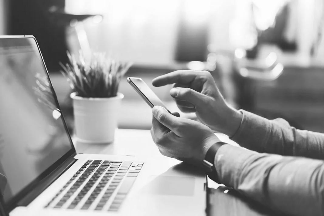 Creative writing student reviewing manuscript with handwritten notes and highlighted sections during peer workshop session